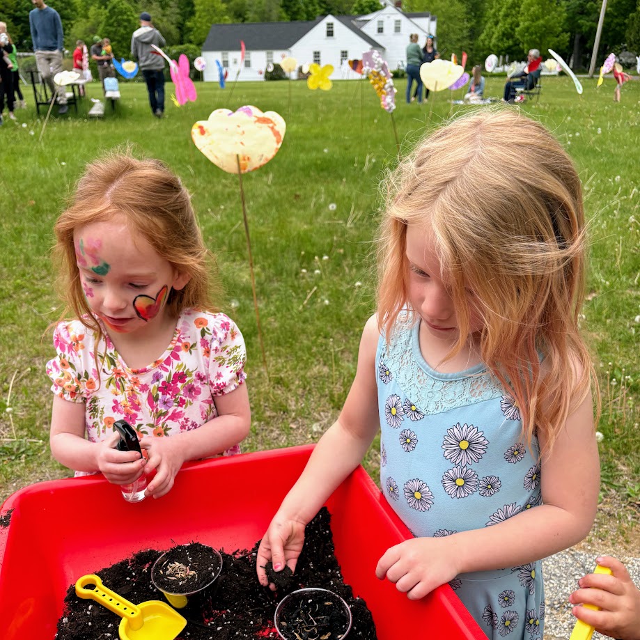 students planting seeds